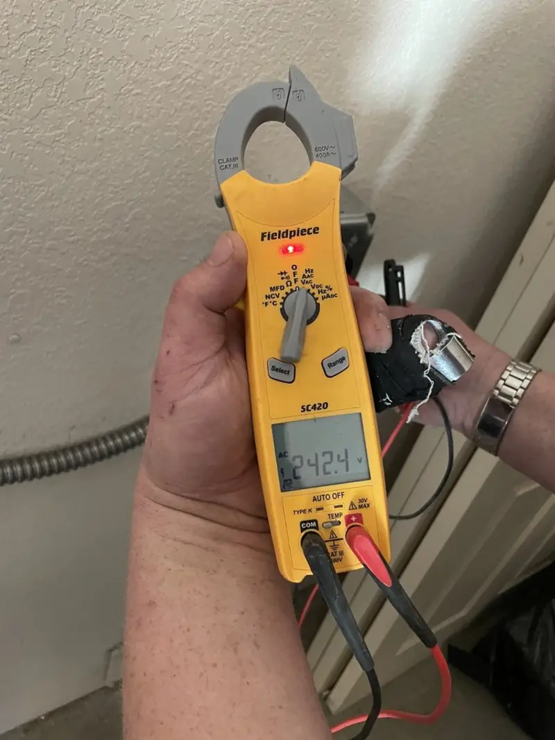 Voltage testing with clamp meter during Whole House Surge Protector in Onalaska